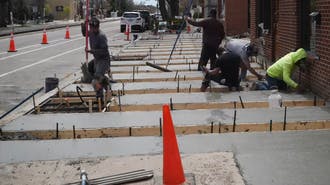 Team installing new concrete for sidewalk in Orange County, CA.