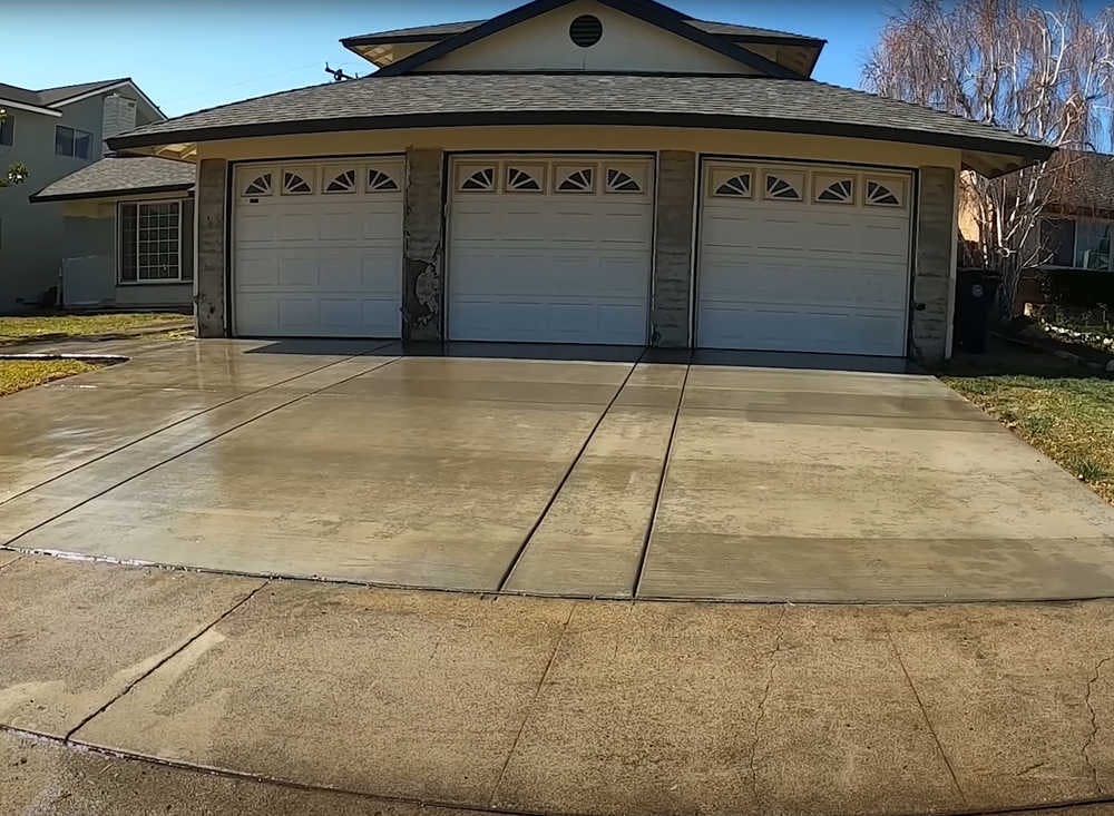Wet concrete driveway installed by a concrete contractor.
